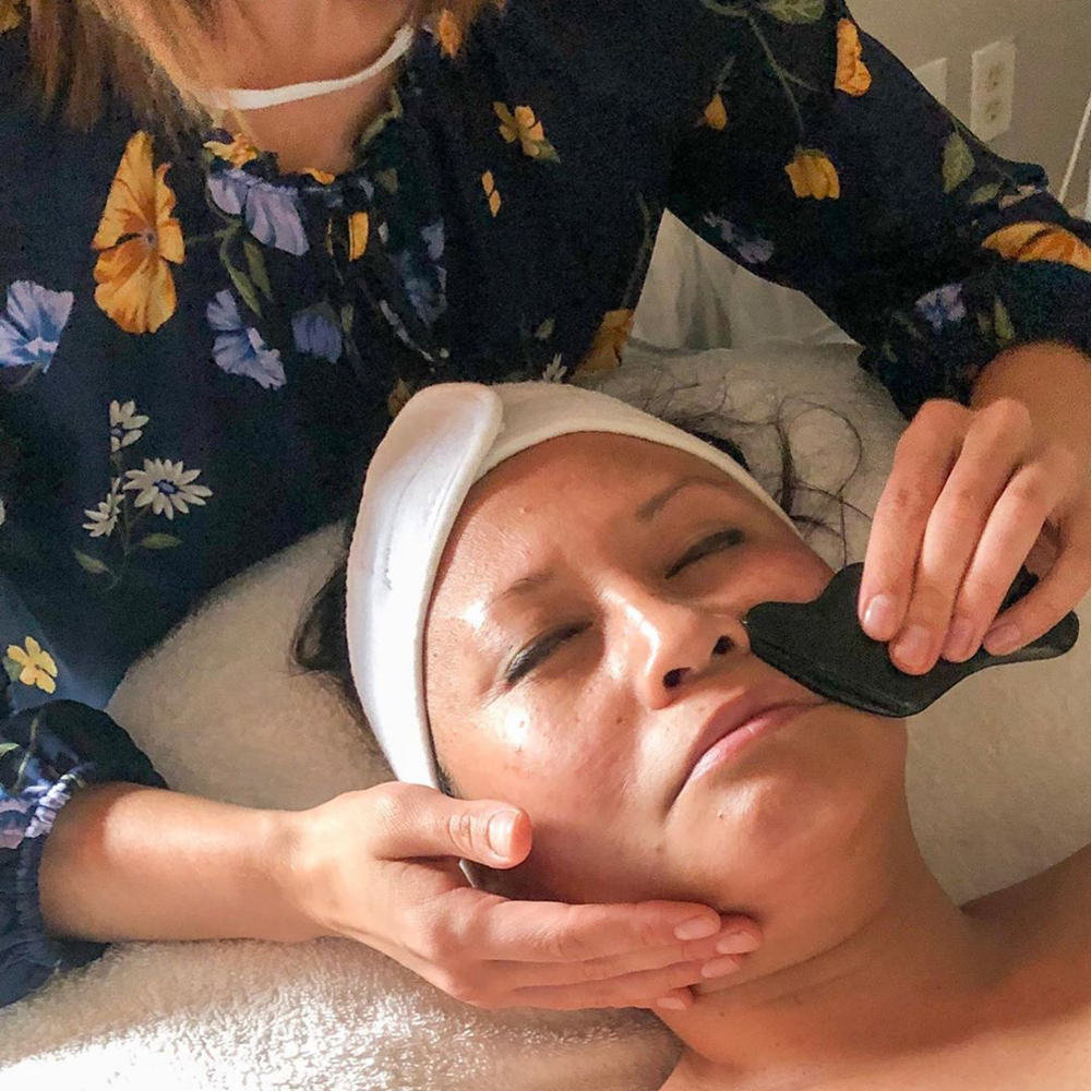 Facial massage is important during a natural facial with a holistic esthetician. Holistic skin care products like massage oil are applied to the face and the holistic esthetician strokes the facial skin with stone tools to increase circulation so the client can have beautiful skin